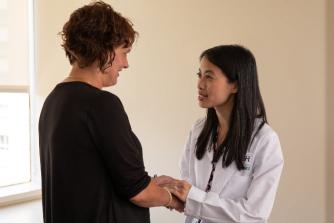 Audrey Kam, MD, with a patient