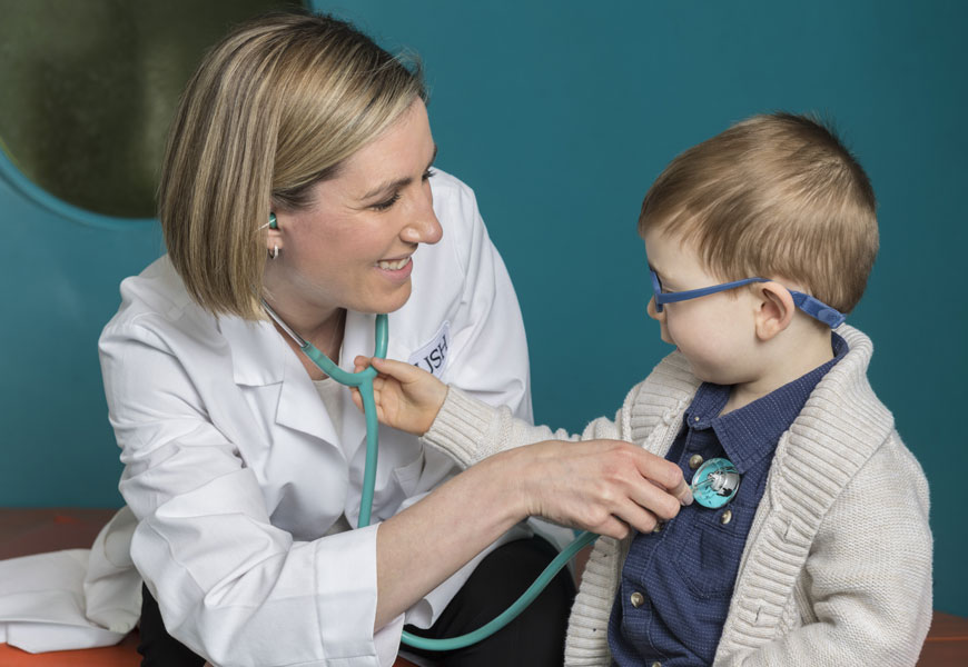 doctor listening to child's heart