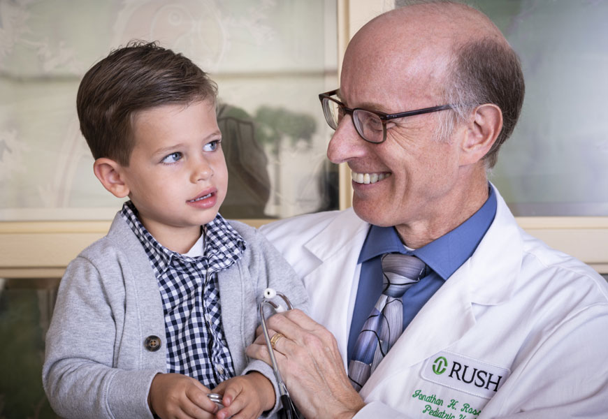 doctor holding child patient
