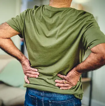 Man grabbing his lower back