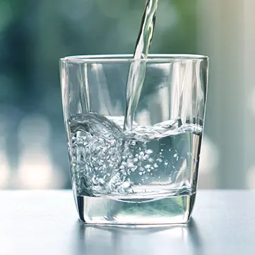 Glass being filled with water