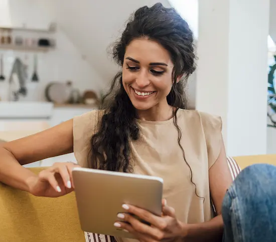 A woman using a tablet for telehealth