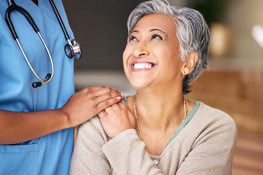 Patient smiling at a doctor