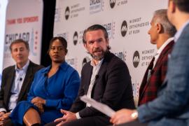 A group of panelists talk at the Chicago Sports Summit.