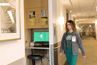 nurse walking into patient room