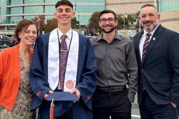 Rob Ferrara stands with his family.