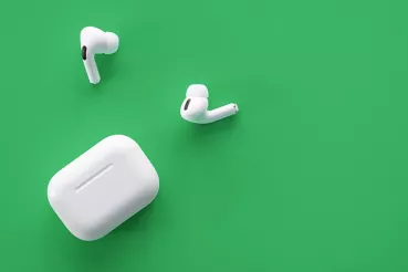 AirPods on green background