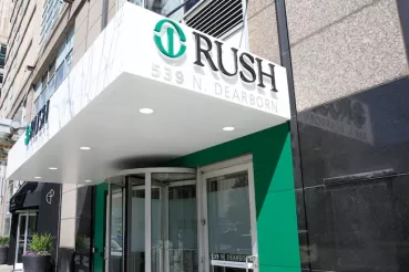 Exterior of Rush Urgent Care in River North. The Rush logo appears on an awning above the entrance.