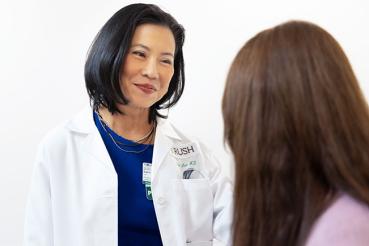 Salina Lee, MD, consulting with a patient