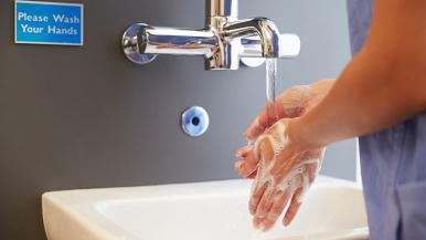 Health care provider washing hands