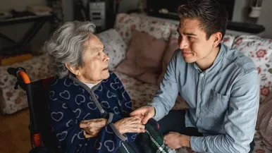 older woman with son who is her caregiver