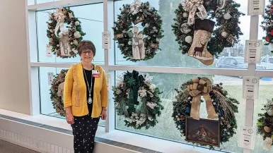 Louise Fazio with wreaths at Rush Copley