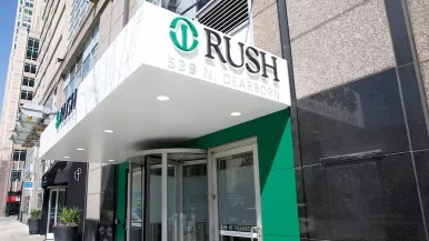 Exterior of Rush Urgent Care in River North. The Rush logo appears on an awning above the entrance.