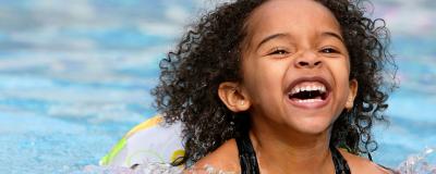 Young girl swimming in pool