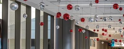 The halls of Rush University Medical Center are decorated with ornaments hanging from the ceiling.