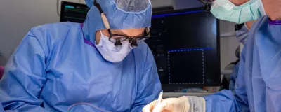 Vascular surgeons meticulously performing a procedure.