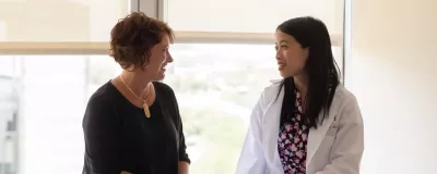 RUSH oncologist Audrey Kam, MD, with a patient.