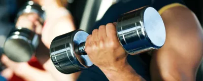 man holding dumbbell